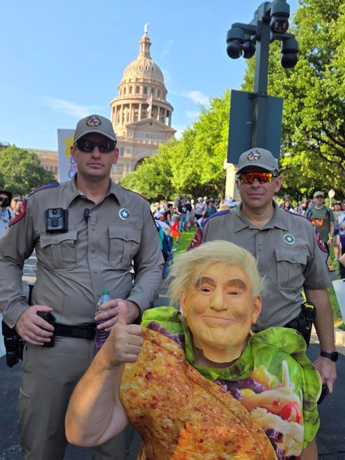 TACO Trump gets a pic with officers at No Kings event